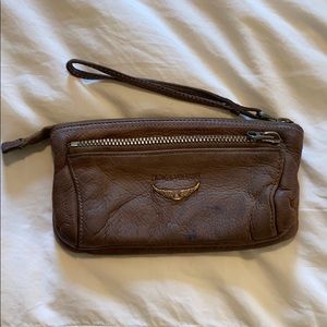 Wristlet leather bag .